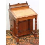 Edwardian oak davenport desk, the lift flap opening to reveal letter racks, the lift writing slope