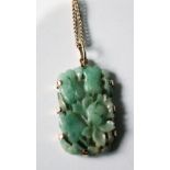 Chinese carved and pierced jadeite pendant in gold mount, 9ct', with necklet. Condition Report Has