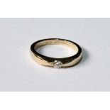 Gold solitaire ring with tension-set diamond brilliant, '.18, 750'. Condition Report 4.9g