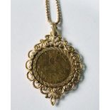 9ct gold coin mount with necklet and metal token.
