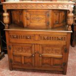 20th century carved oak buffet with two frieze drawers, two panel doors and a single panel door