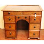 Colonial padouk kneehole desk with frieze drawer over a pair of three-drawer pedestals and small