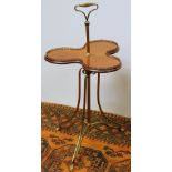 Edwardian mahogany butler's occasional table with revolving brass galleried trefoil top on three