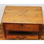19th century pine bible box with hinged slope top on four short, turned legs, 62cm wide and 38cm