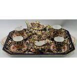 Royal Crown Derby Imari pattern tea set for four with teapot, sugar and milk on a matching Royal