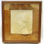 Clay relief portrait of a lady, monogrammed C.H., in deep oak and glazed frame, 39.5cm x 35cm.