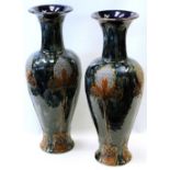 Pair of Royal Doulton stoneware vases by Florrie Jones with Art Nouveau style panels, 46.5cm high.
