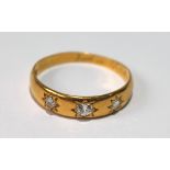Diamond three-stone ring with brilliants star-set in 18ct gold, 1889. Condition Report 22ct gold,