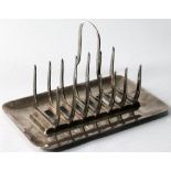 Unusual EP toast rack with stirrup-shaped divisions by Romney for Liberty & Co. Condition Report