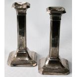 Pair of silver candlesticks of square section with reeded corners by Henry Matthews, Birmingham