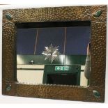 Arts & Crafts style wall mirror in rosette hammered brass frame with enamel oval inserts at the