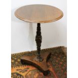 Circular oak occasional table with carved column and triangular base, on three bun feet, 56cm