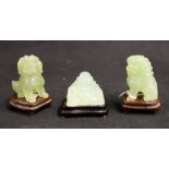 Pair of 20th century green jade lions and stands, 6.