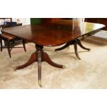 19th century mahogany twin pillar pedestal dining table, the top with reeded edges and one extra