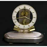 Junghans , anticlimatic electric mantle clock, under dome.