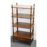 Victorian four tier mahoganay etagere, with baluster supports and base drawer on short legs and