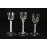 Three Georgian opaque twist cordial glasses each with double helix twist stems,