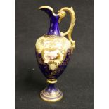 Coalport early 20th century ewer of urn form with landscape reserves, 19cm CONDITION REPORT: Foot