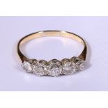 Diamond five stone ring with graduated brilliant cut stones measuring from 3mm to 4mm,