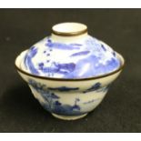 Chinese 18th century blue and white cup and cover decorated with a watery landscape scene, the
