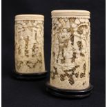Pair of 19th century Chinese finely carved and pierced ivory brush pots decorated with relief carved