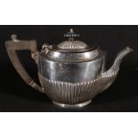 Edwardian silver oval teapot with semi fluted body,