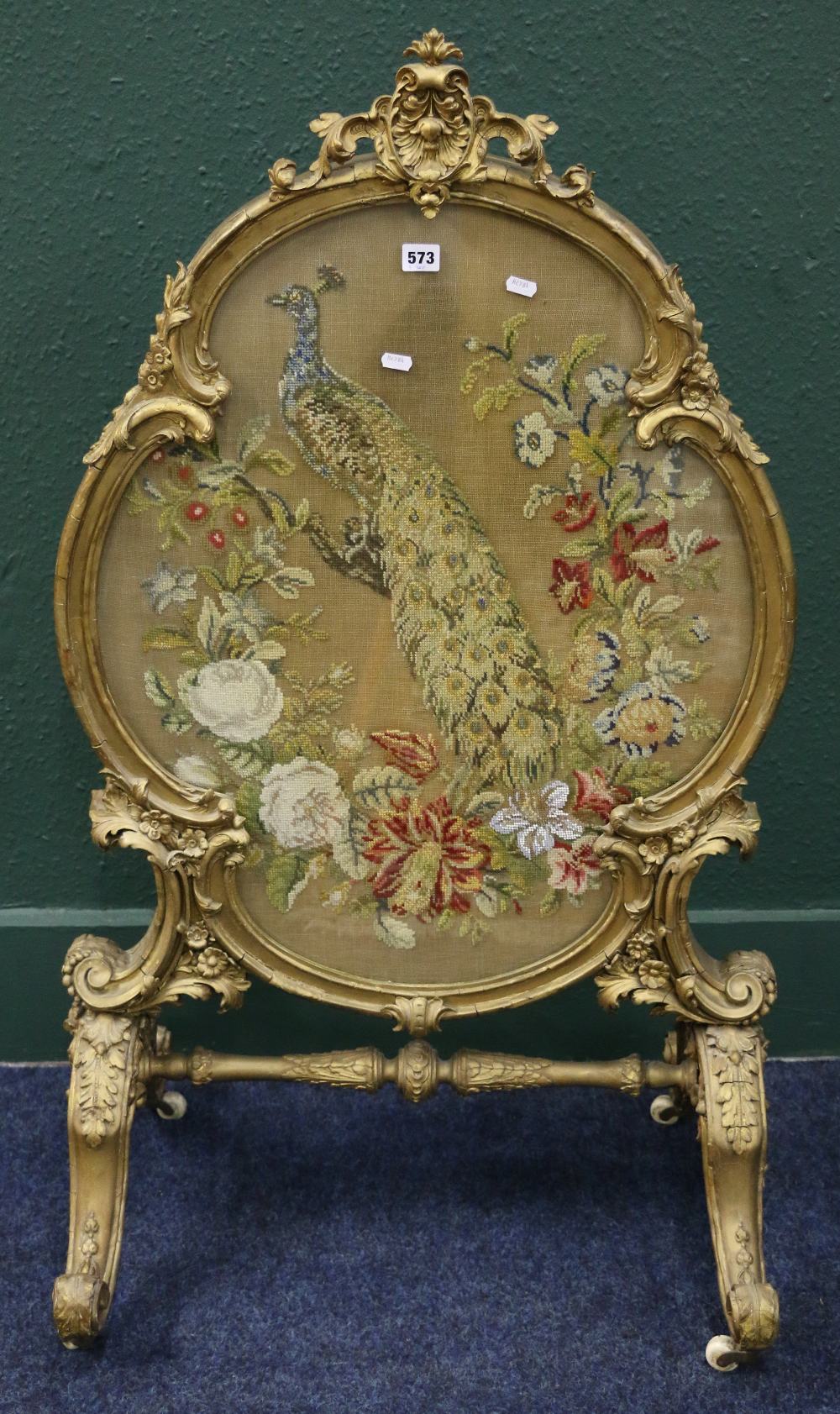 Victorian gilt gesso oval firescreen with beadwork and wool peacock tapestry on scrolling cabriole