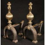 Pair of Victorian steel and brass andirons with arched feet.