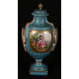 Sevres style gilt porcelain urn and cover, with reserve depicting lovers and a floral sprays,