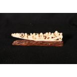 A 19th century ivory carving of the Shichifukujin or gods of good fortune in a boat with a dragon