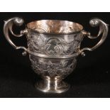 18th century Irish twin handled loving cup with embossed scrolls and leafage, Dublin circa 1750,