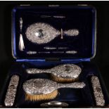 Edwardian silver dressing set comprising pair of hair brushes,