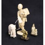 Japanese sectional ivory model of a farmer carrying a basket on his back, a carved ivory elephant