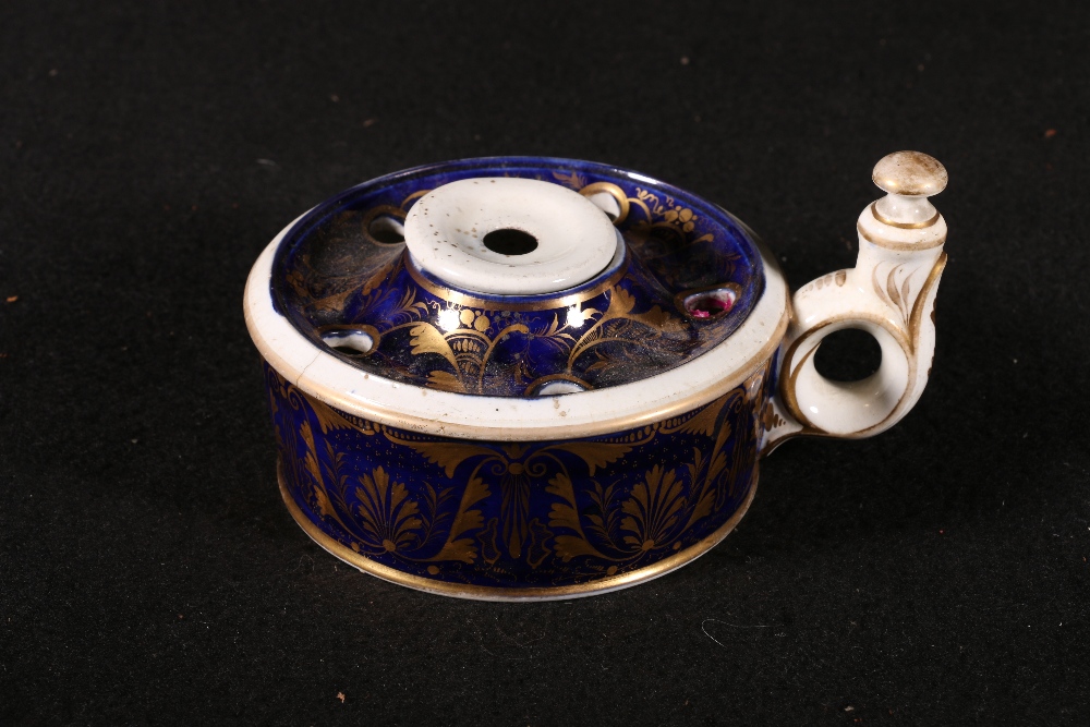 Derby gilt decorated porcelain inkwell of circular form with ring handle and anthemion decoration,