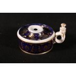 Derby gilt decorated porcelain inkwell of circular form with ring handle and anthemion decoration,