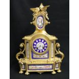 Late 19th century French gilt brass porcelain mounted clock, with Roman gilt porcelain dial, the