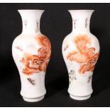 Pair of Chinese late 19th century / early 20th century vases decorated with shi shi dogs in an