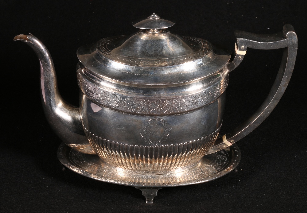 George III semi fluted oval silver teapot with floral band, initials in cartouches, Edinburgh 1802