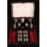 Victorian silver plated condiment set, together with a cased set of six numbered epns napkin rings.