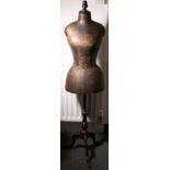 Victorian tailors dummy on a turned stand with triple cabriole supports, the body covered in waxed
