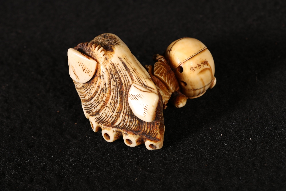 Japanese ivory carving of an oni carrying a large sack on his back, a.f. and an associated stand - Image 2 of 4