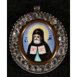 Greek silver pendant with enamelled figure of a Saint with paste set border inscribed circa 1800