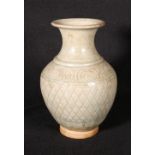 Chinese longquan celadon vase of bulbous form and flaring rim, the body with slightly crackled