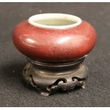 Early 20th century Chinese sang de boeuf brush washer of squat form, four character mark to base,