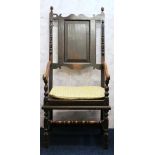 18th century oak armchair with panelled back and solid seat,