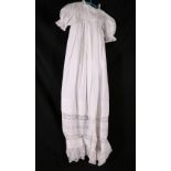 Long white cotton christening robe with lace and pintuck decoration also two lawn robes and two