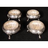 Set of  four Victorian silver salts with Greek key engraving and clear star cut glass liners,