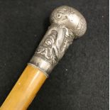 Chinese malacca cane, the silver pommel decorated in relief with a dragon and good luck characters,