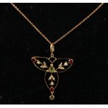 Edwardian 9ct gold peridot, seed pearl and garnet trefoil pendant, on a 9ct belcher chain. 24cm long