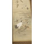19th century Japanese scroll painting on silk depicting a white crane and other birds by a river,